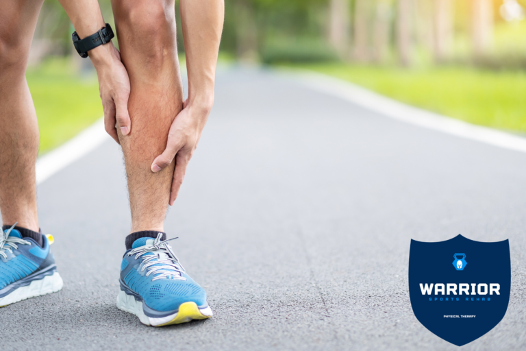 runner holding leg from shin splint pain